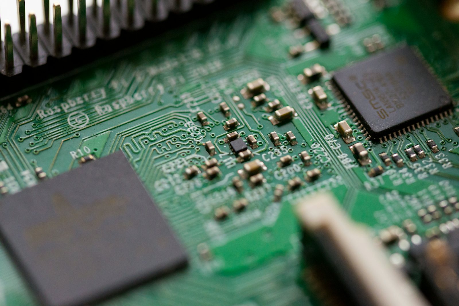 Macro photograph of a printed circuit board with gold-plated contacts